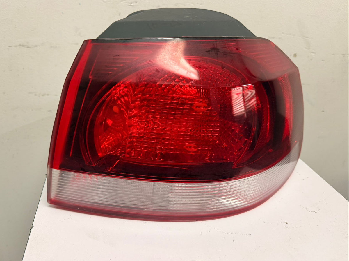 VOLKSWAGEN GOLF/GTI 2010-2014 Passenger Taillamp assy outer w/o LED Lamps; Hella Brand; Lens/Housing Only