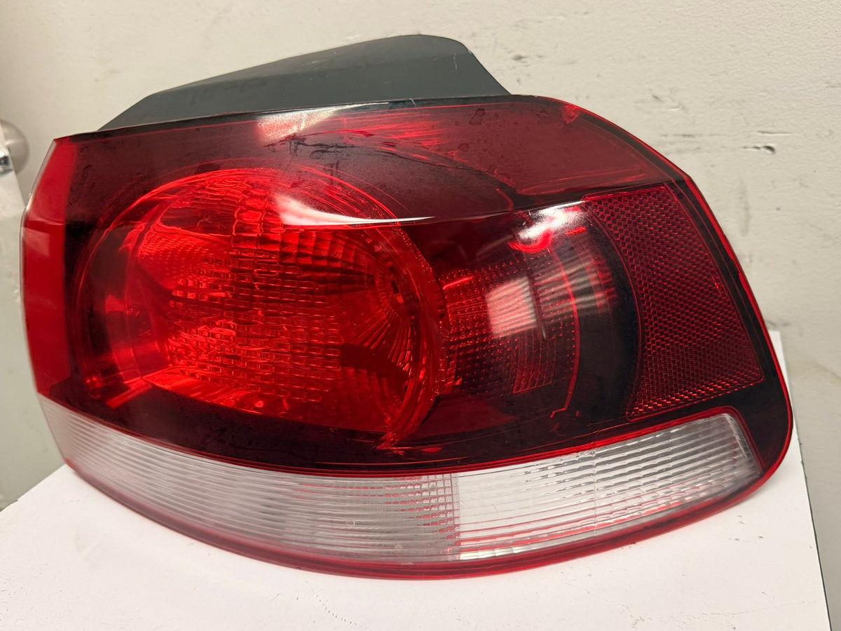 VOLKSWAGEN GOLF/GTI 2010-2014 Passenger Taillamp assy outer w/o LED Lamps; Hella Brand; Lens/Housing Only
